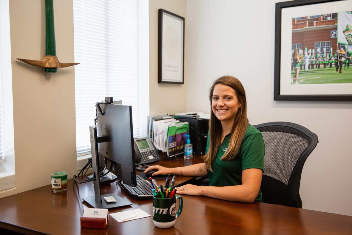 Admissions Counselor sitting at a desk